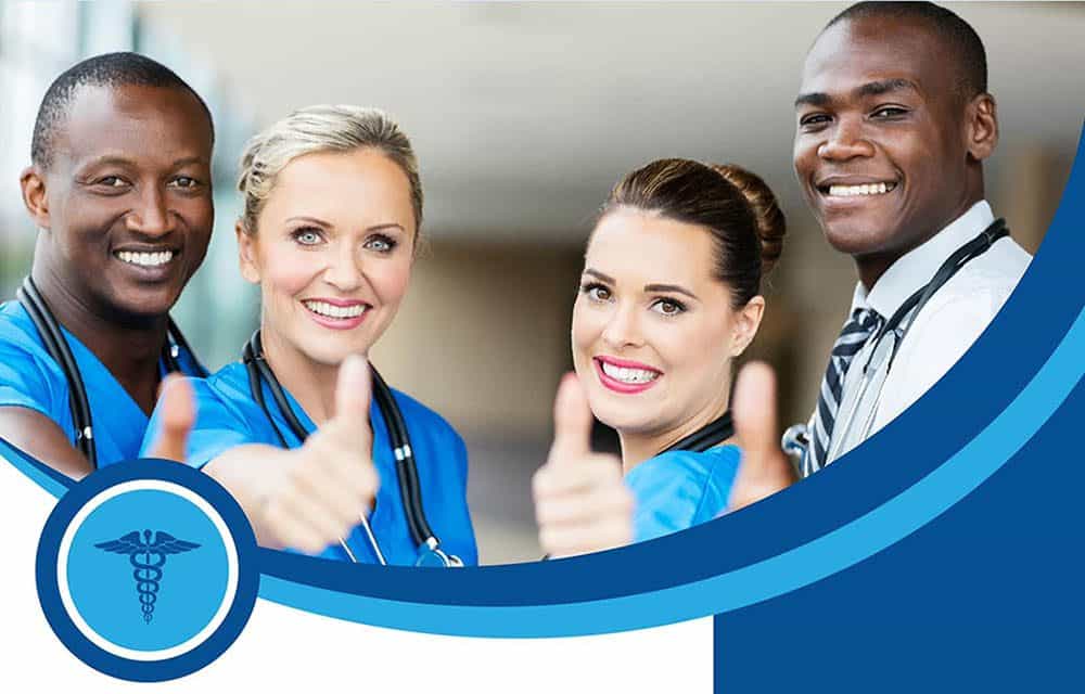 Smiling dental team members giving a thumbs up | Harwell & Cook Orthodontics