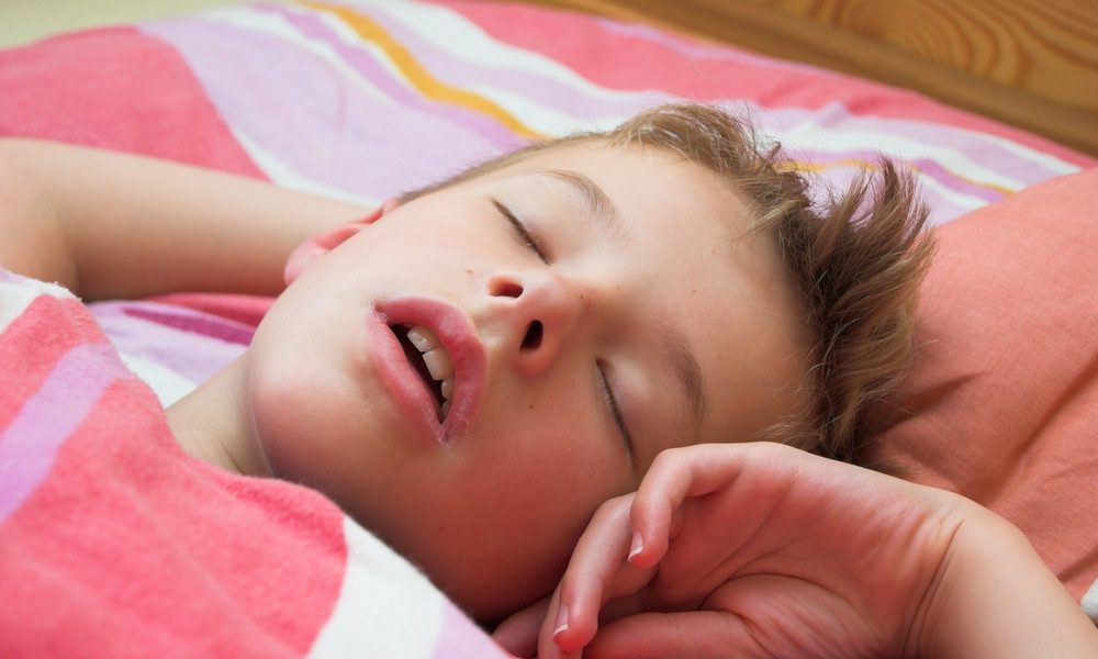 Close-up of a young child sleeping peacefully | Harwell & Cook Orthodontics Smiling