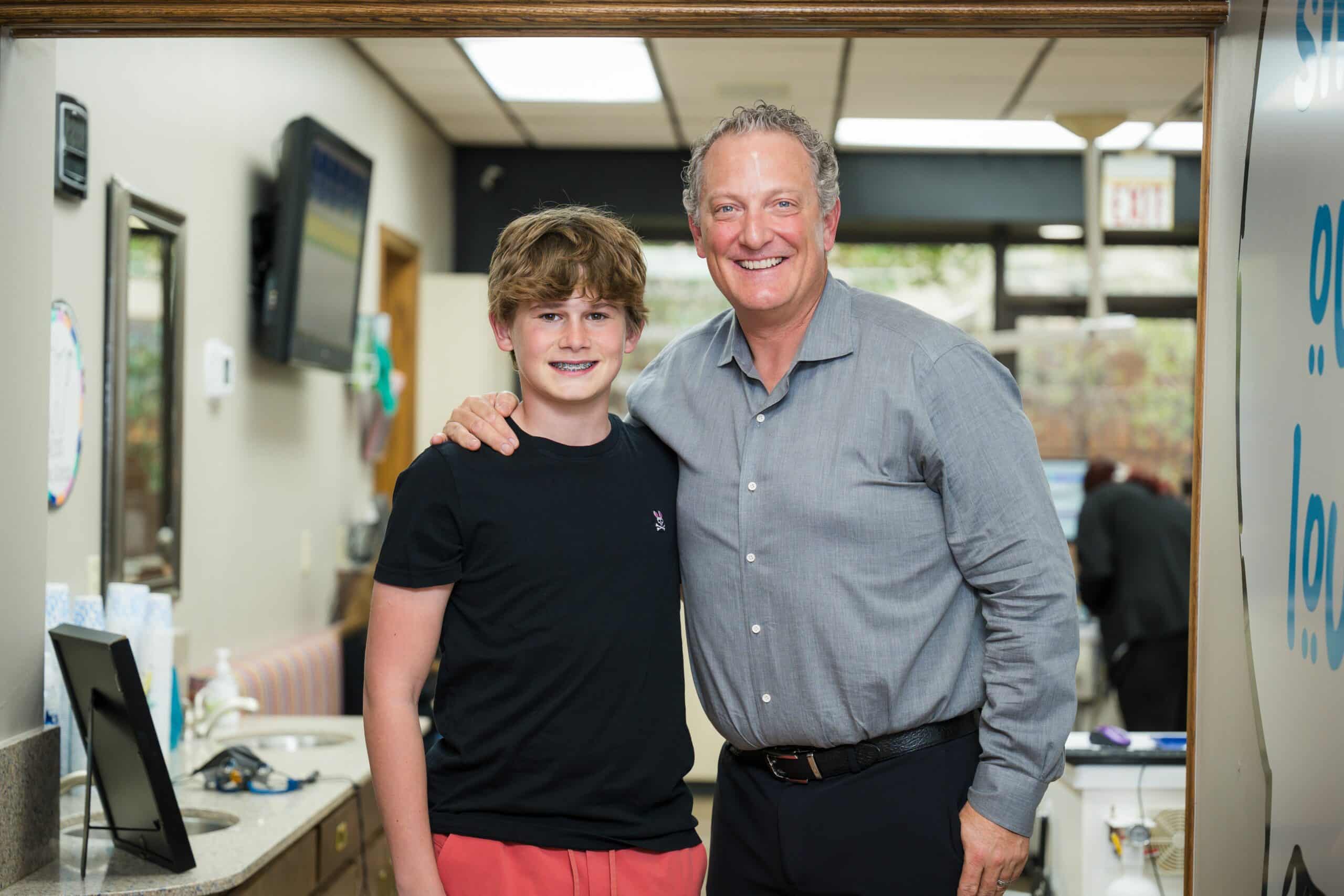Dr. Anthony and a boy | Harwell & Cook Orthodontics