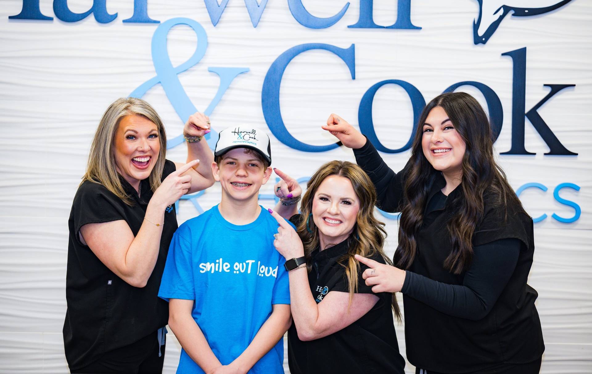 Three smiling young people. | Harwell & Cook Orthodontics