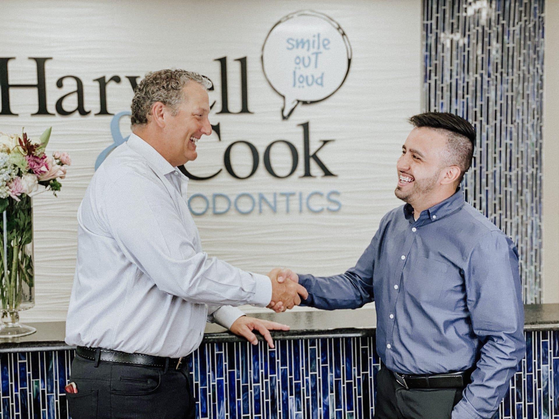 Two men posing in the practice office. | Harwell & Cook Orthodontics