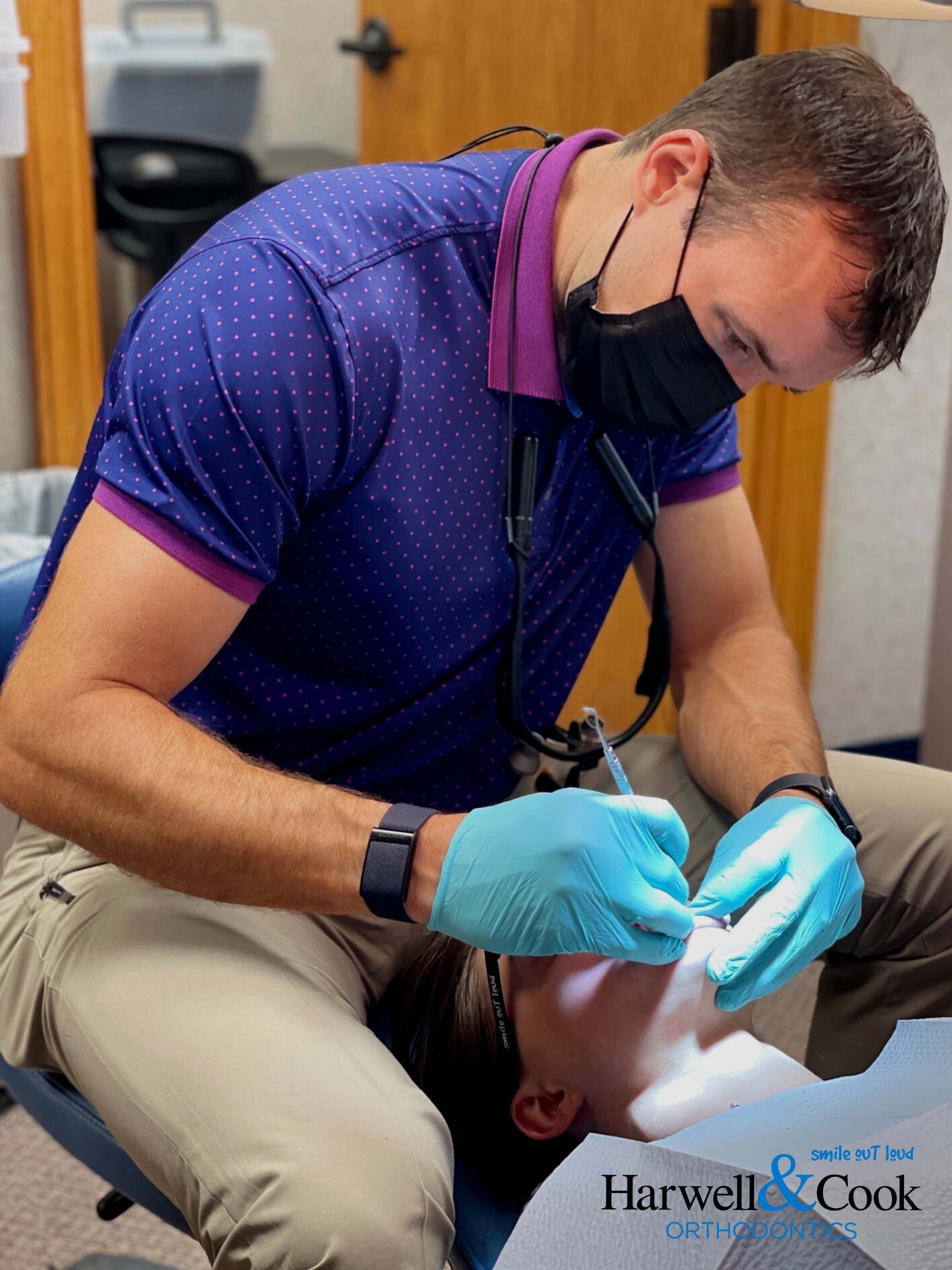 An orthodontist performing a procedure. | Harwell & Cook Orthodontics