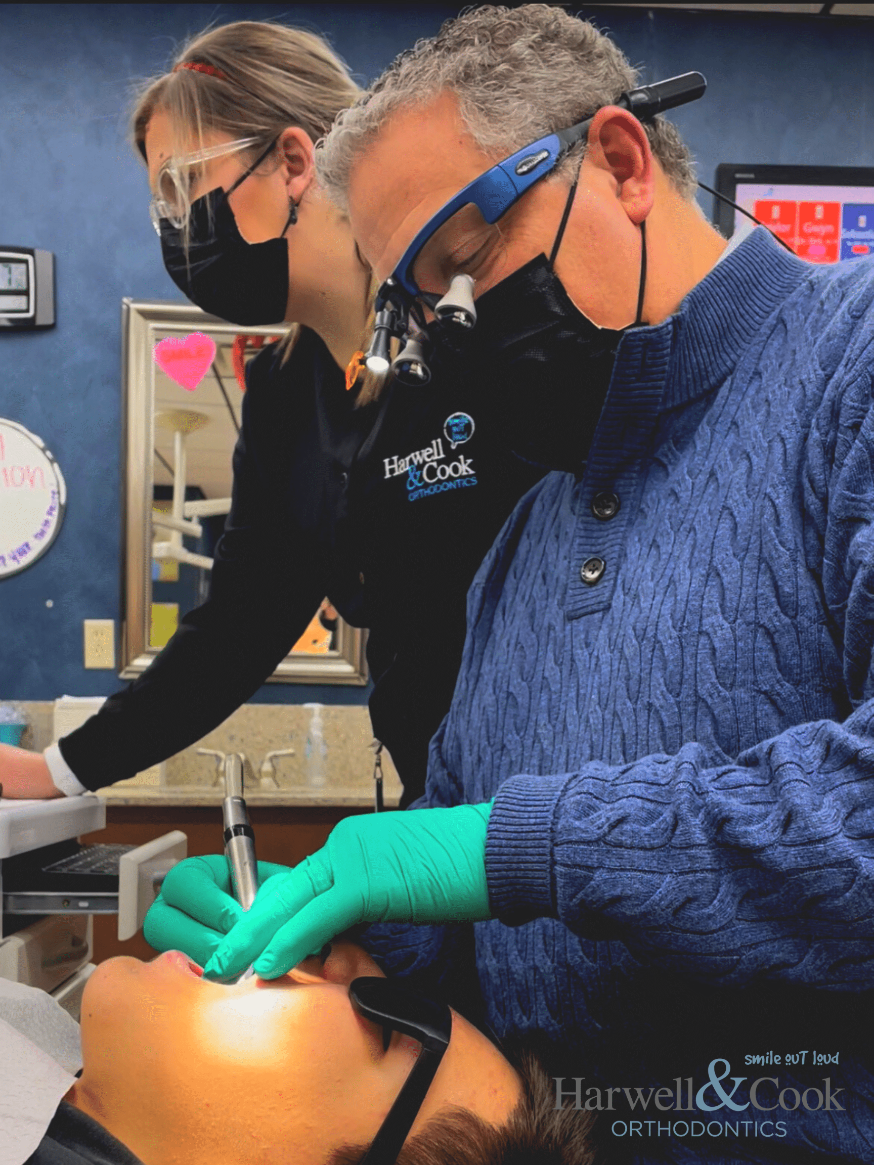 An orthodontist focused on working on a model of teeth. | Harwell & Cook Orthodontics