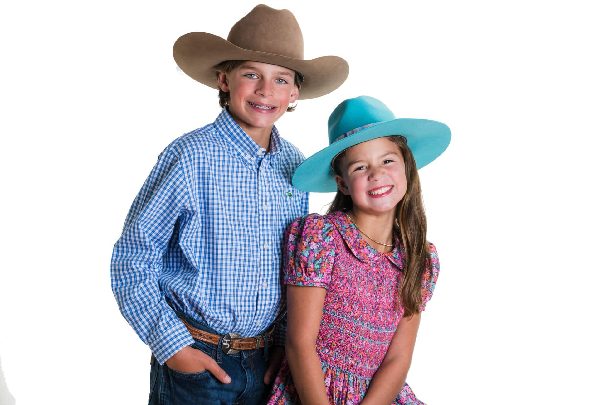 Two kids in western wear. | Harwell & Cook Orthodontics