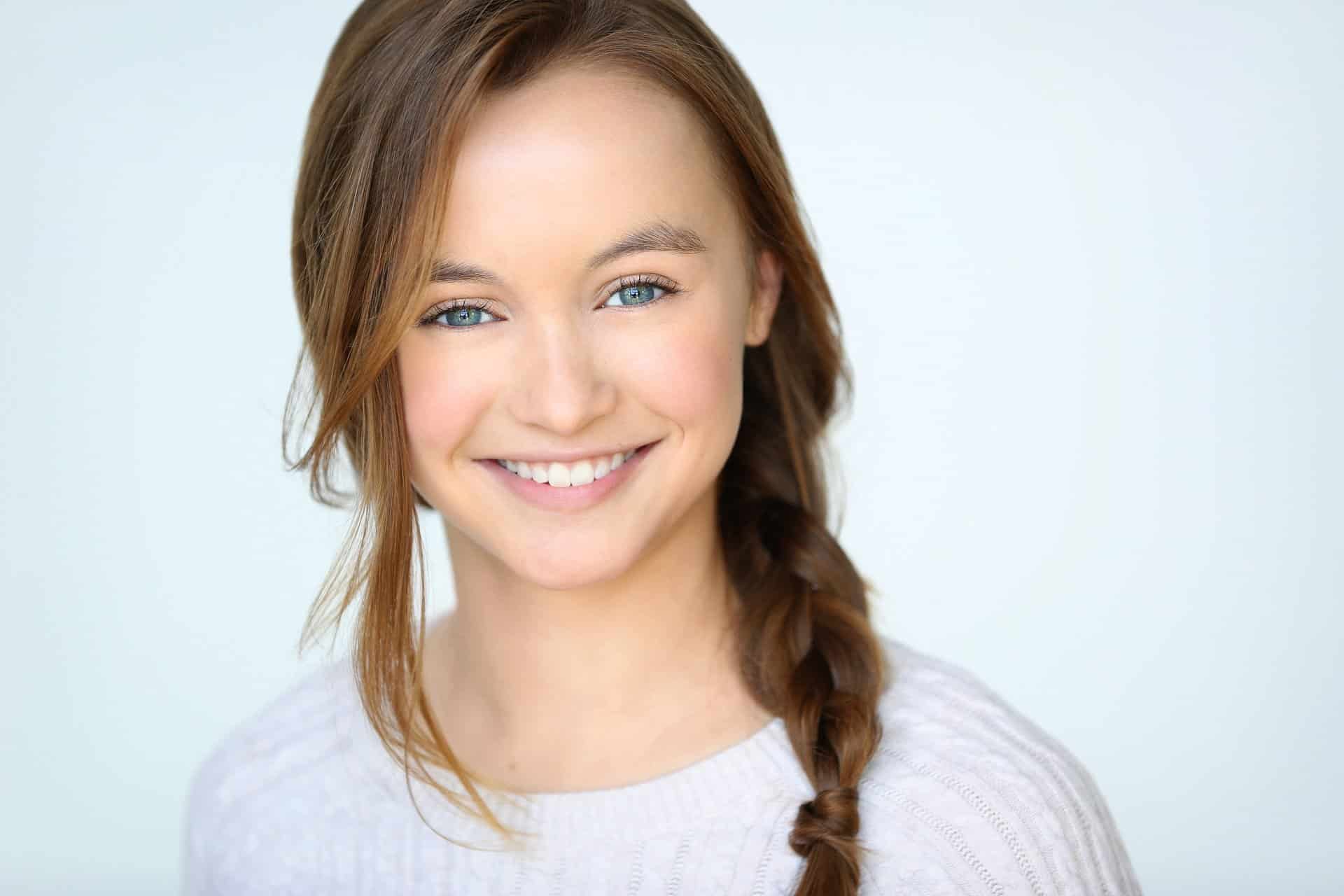 A smiling young woman posing | Harwell & Cook Orthodontics